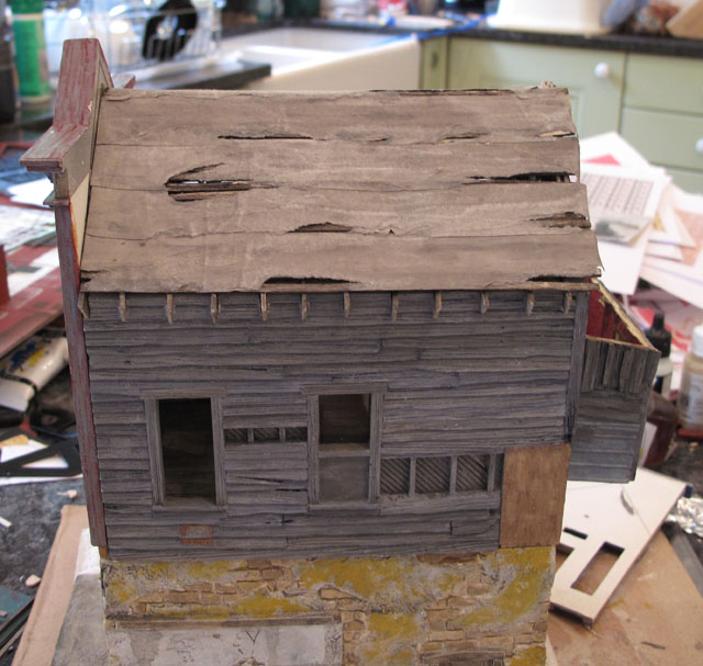 Bordello torn tar paper